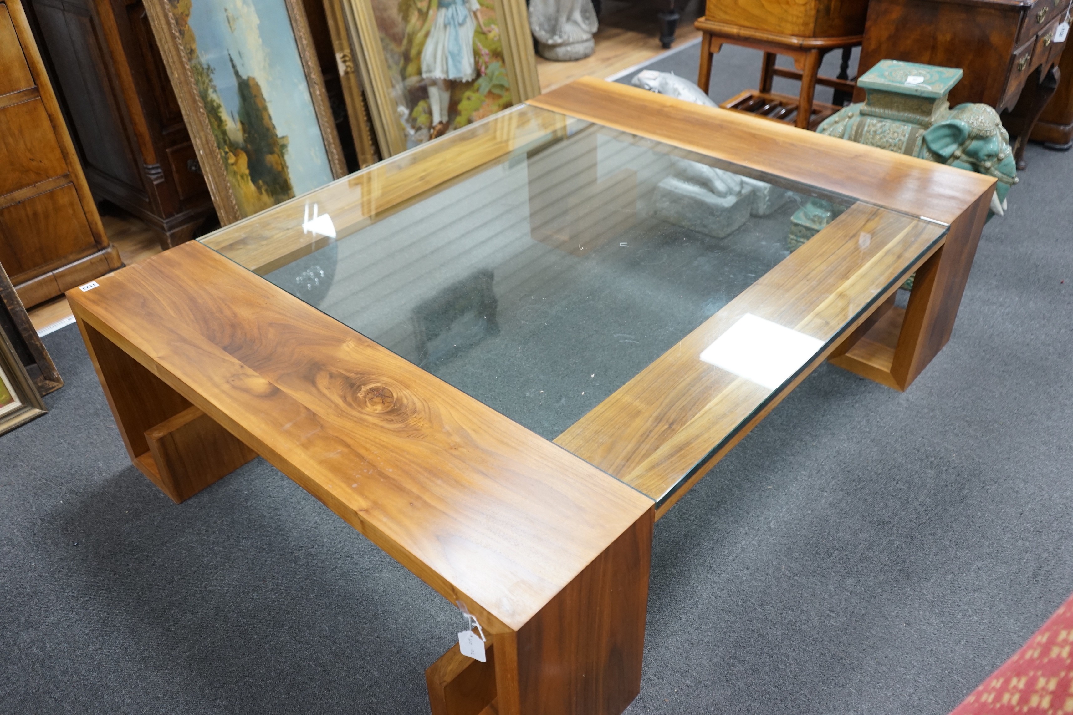 A contemporary hardwood and plate glass coffee table, length 160cm, depth 120cm, height 45cm